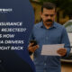 An Indian man stands in front of a damaged car, holding a phone and a rejection letter, appearing concerned after his car insurance claim was denied.