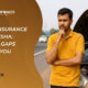 Worried man standing beside a broken-down car on a highway in Odisha, highlighting car insurance gaps – KlaimPower